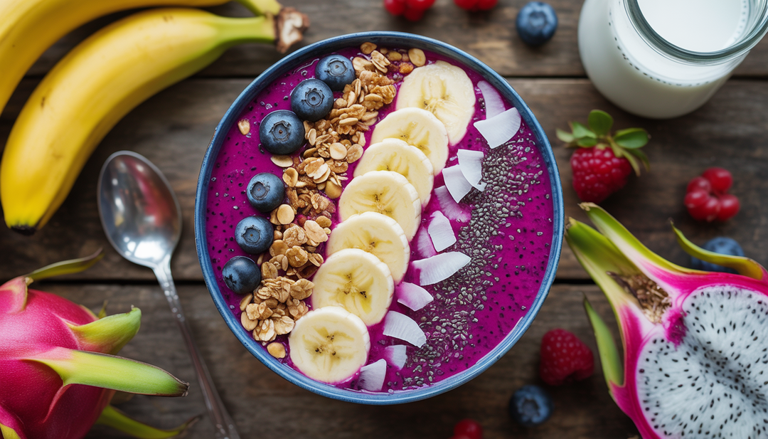 A colorful dragon fruit smoothie bowl with toppings, set on a wooden table with fresh fruits and almond milk around it.
